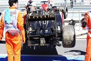 The Lotus F1 E21 of Kimi Raikkonen, Lotus F1 Team is recovered back to the pits on the back of a truck after he crashed at the end of the first practice session