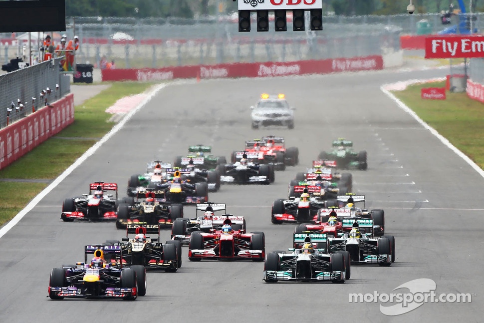 Sebastian Vettel, Red Bull Racing RB9 leads at the start of the race