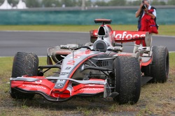 Lewis Hamilton's, McLaren Mercedes parked at the side of the track with badly worn tyres
