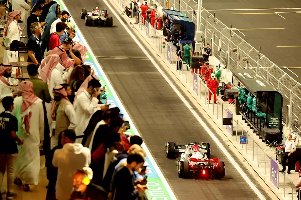 Lewis Hamilton, Mercedes W13, George Russell, Mercedes W13, in the pit lane