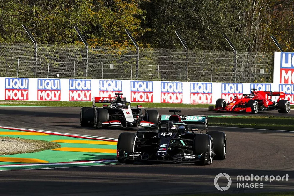 Lewis Hamilton, Mercedes F1 W11, Romain Grosjean, Haas VF-20, and Sebastian Vettel, Ferrari SF1000