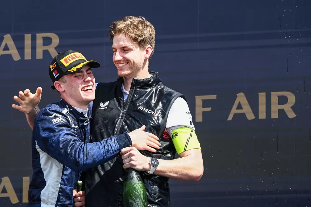 Luke Browning (GBR, Hitech Pulse-Eight), 1st position, celebrates with a team mate on the podium