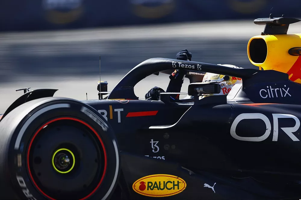 Max Verstappen, Red Bull Racing RB18, 1st position, celebrates during his victory lap on his way to Parc Ferme