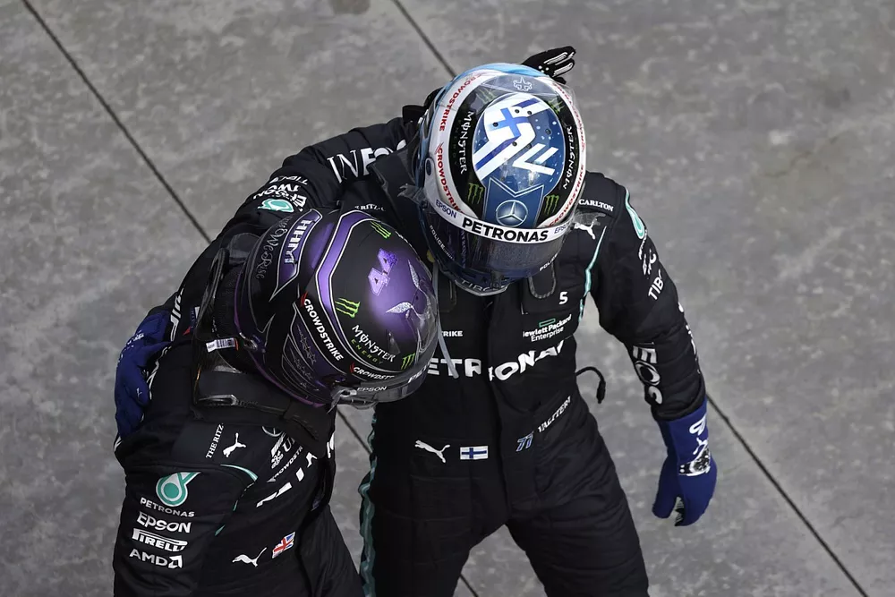 Pole man Lewis Hamilton, Mercedes, is congratulated by Valtteri Bottas, Mercedes, in Parc Ferme
