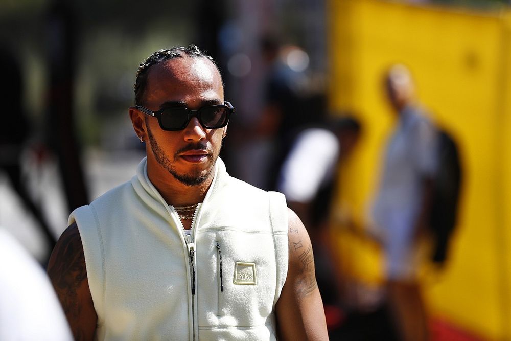 Lewis Hamilton, Mercedes-AMG, arrives into the paddock