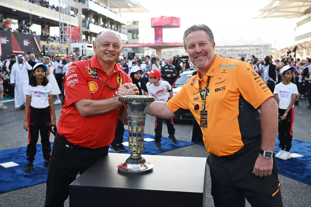 Frederic Vasseur, Team Principal and General Manager, Scuderia Ferrari, and Zak Brown, CEO, McLaren Racing, on the grid with the Constructors Championship trophy prior to the start