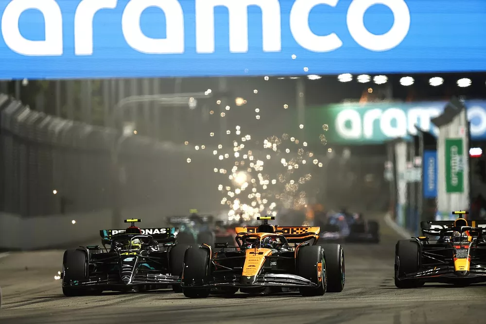 Lando Norris, McLaren MCL60, battles with Lewis Hamilton, Mercedes F1 W14, ahead of Sergio Perez, Red Bull Racing RB19