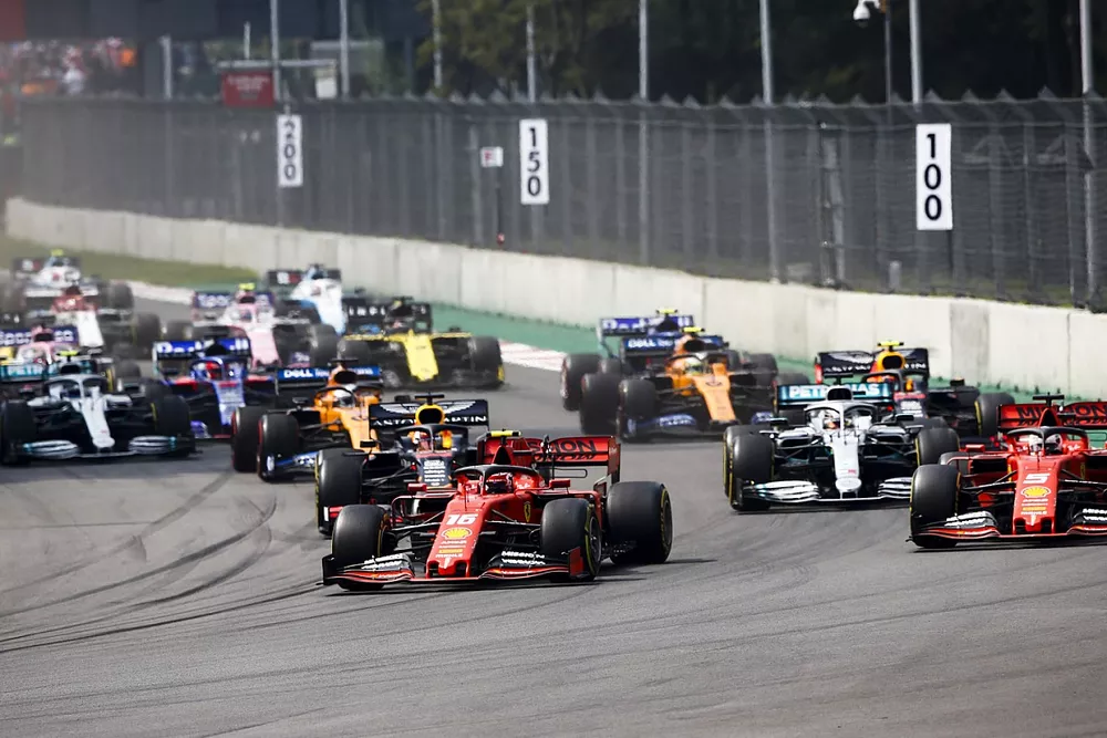 Charles Leclerc, Ferrari SF90, leads Sebastian Vettel, Ferrari SF90, Lewis Hamilton, Mercedes AMG F1 W10, Max Verstappen, Red Bull Racing RB15, Carlos Sainz Jr., McLaren MCL34, and the rest of the field at the start