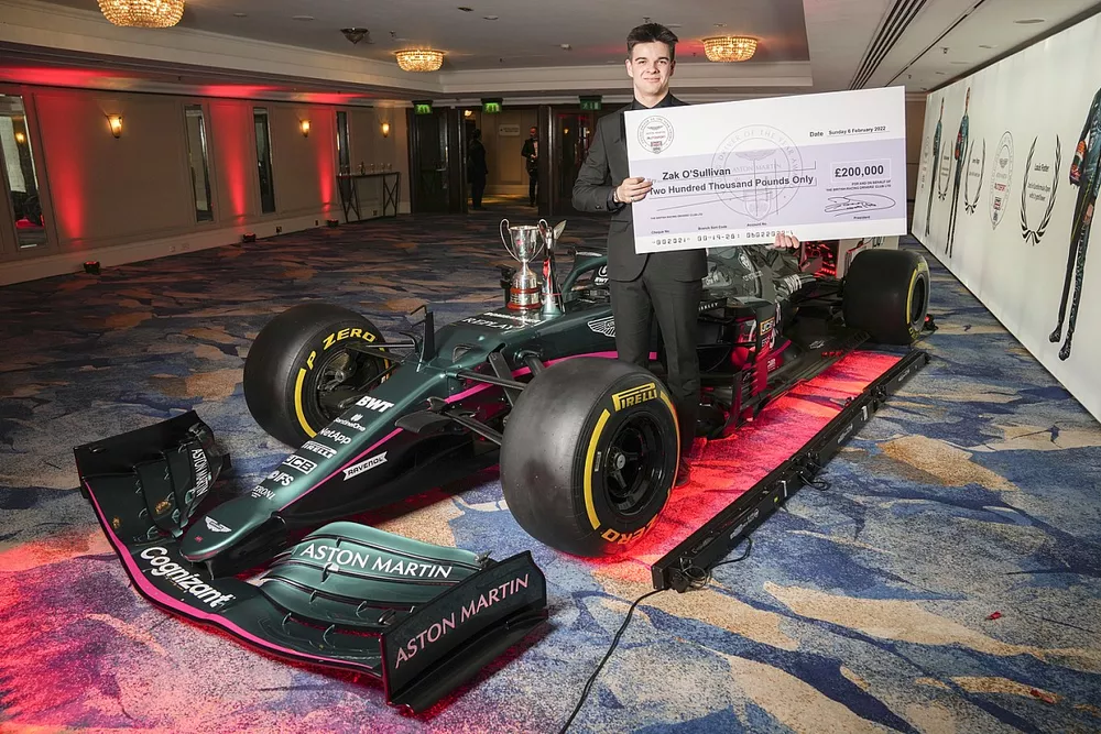 Zak O'Sullivan, Aston Martin Autosport BRDC Young Driver of the Year Award winner, with the Aston Martin AMR21 and his cheque