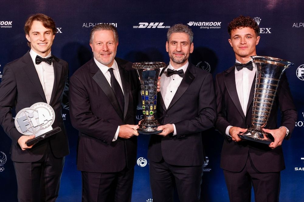 Lando Norris, McLaren, Oscar Piastri, McLaren, Andrea Stella, Team Principal of McLaren and Zak Brown, Chief Executive Officer of McLaren
