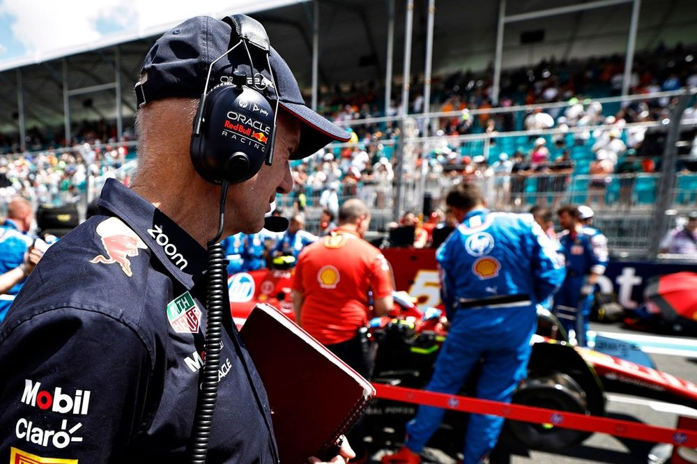 Adrian Newey, Chief Technology Officer, Red Bull Racing inspects the car of Charles Leclerc, Ferrari on the grid