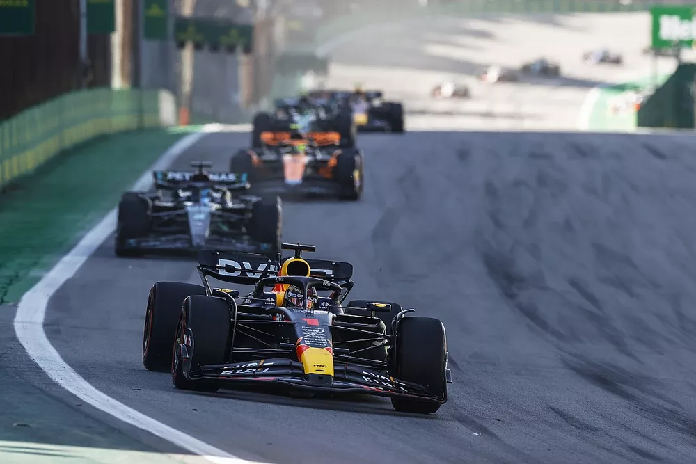 Max Verstappen, Red Bull Racing RB19, leads George Russell, Mercedes F1 W14, Lando Norris, McLaren MCL60