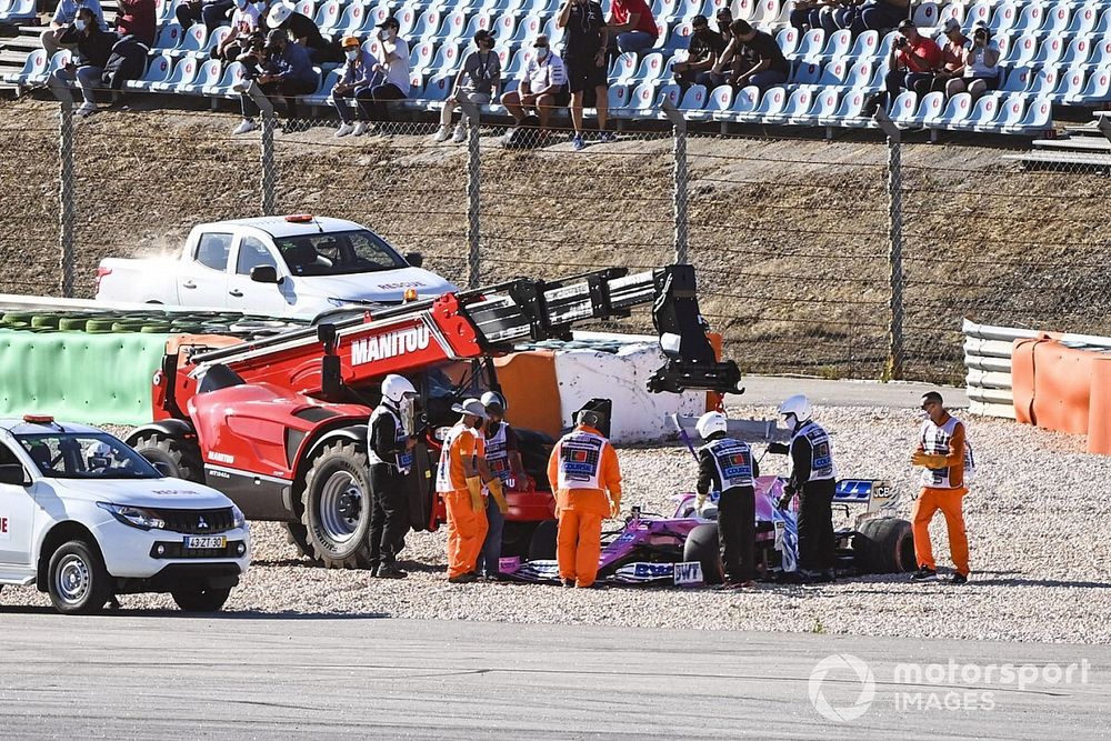 Marshals remove the car of Lance Stroll, Racing Point RP20, after a collision with Max Verstappen, Red Bull Racing RB16, during FP2