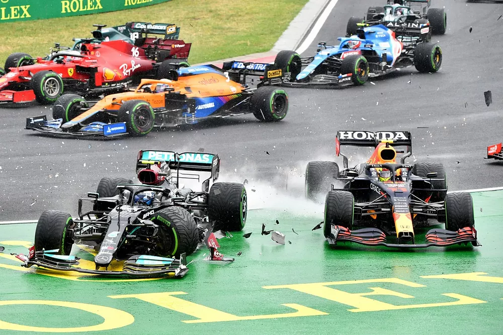 Valtteri Bottas, Mercedes W12, collides with Sergio Perez, Red Bull Racing RB16B, at the start
