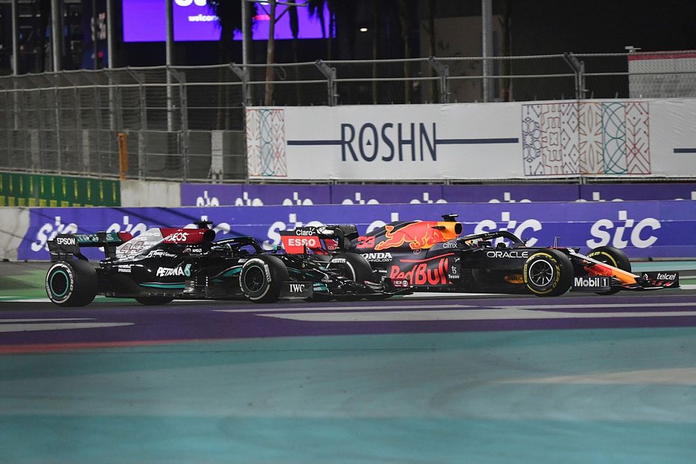 Max Verstappen, Red Bull Racing RB16B, battles with Lewis Hamilton, Mercedes W12