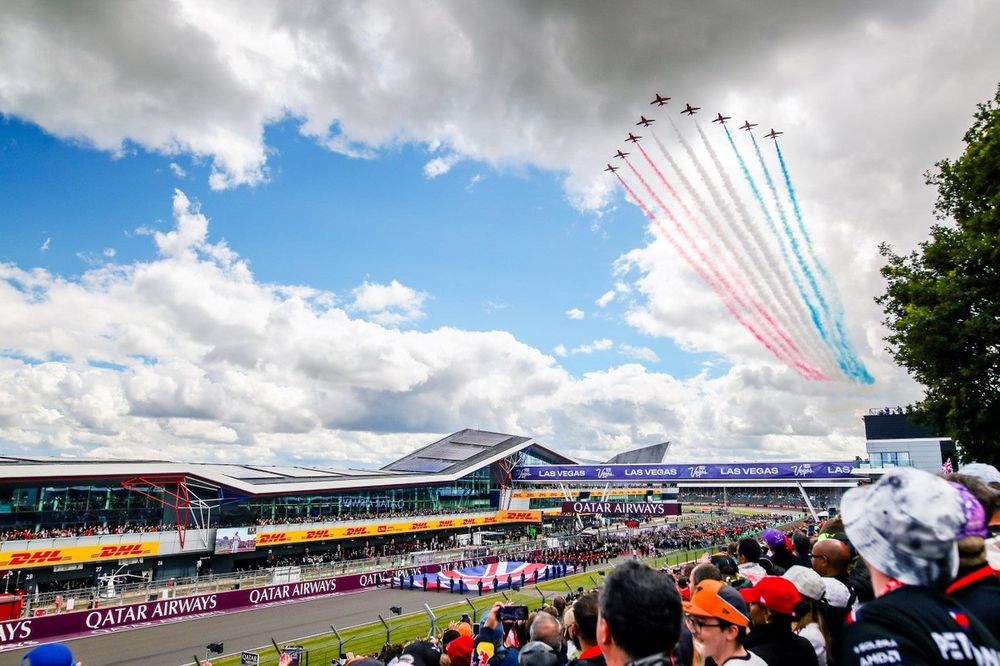 Red Arrows fly over British GP starting grid