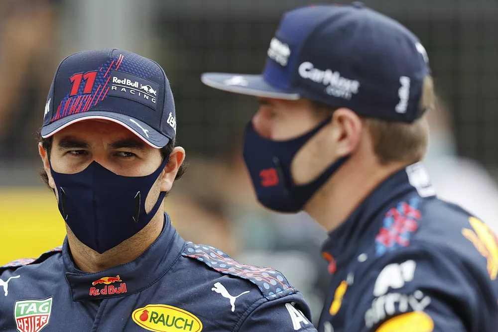 Sergio Perez, Red Bull Racing, and Max Verstappen, Red Bull Racing, on the grid, ahead of the 2022 Formula 1 car unveiling