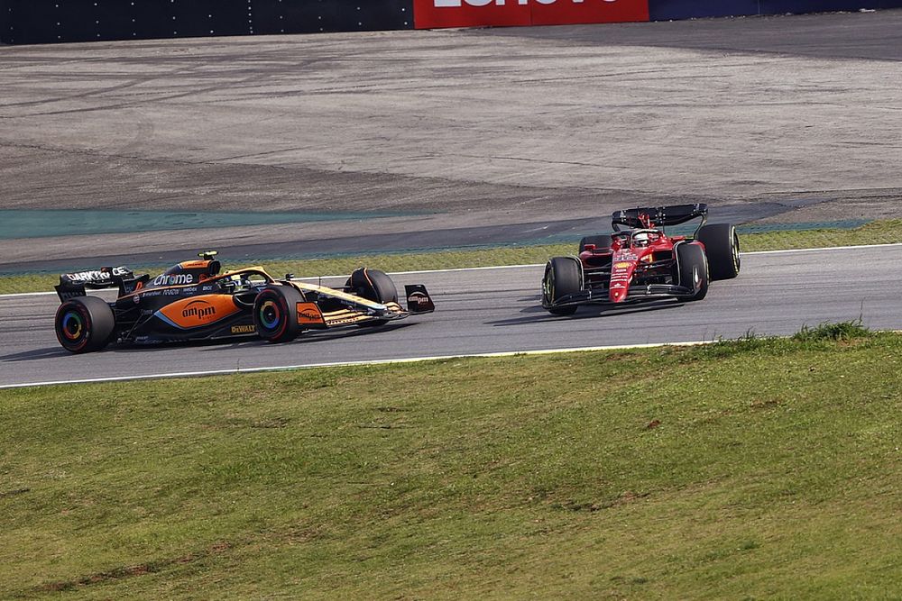 Contact between Lando Norris, McLaren MCL36, Charles Leclerc, Ferrari F1-75, results in a spin