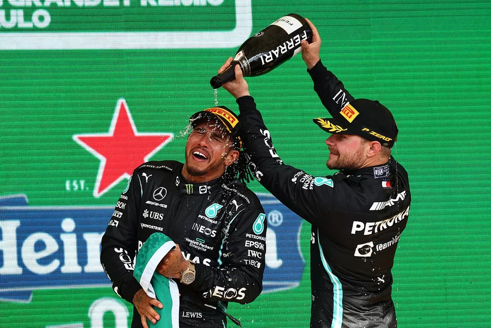 Valtteri Bottas, Mercedes, 3rd position, pours Champagne over Lewis Hamilton, Mercedes, 1st position, on the podium