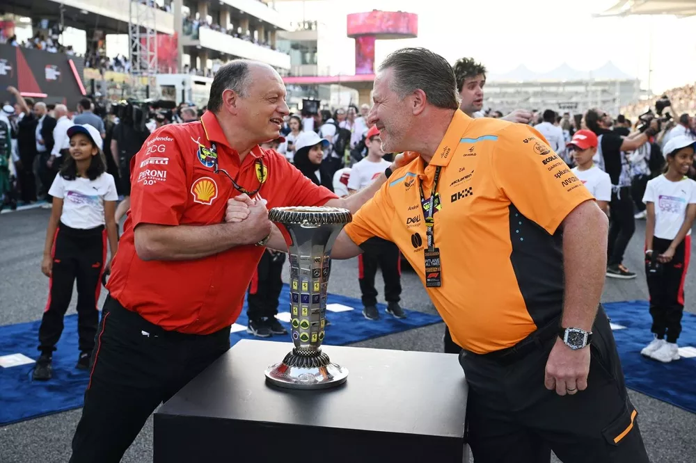Frederic Vasseur, Team Principal and General Manager, Scuderia Ferrari, Zak Brown, CEO, McLaren Racing, on the grid with the Constructors Championship trophy prior to the start