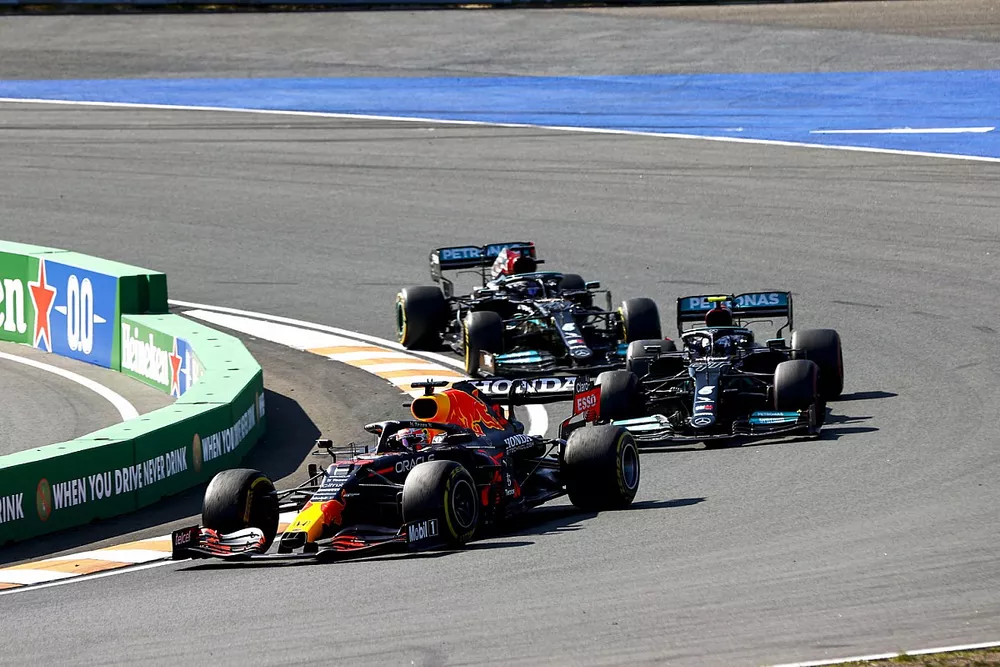 Max Verstappen, Red Bull Racing RB16B, Valtteri Bottas, Mercedes W12, and Lewis Hamilton, Mercedes W12