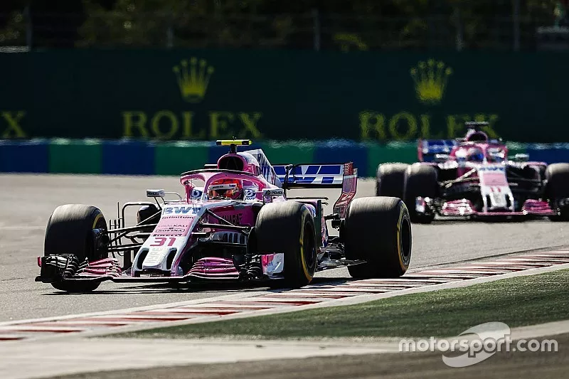 Esteban Ocon, Force India VJM11, leads Sergio Perez, Force India VJM11