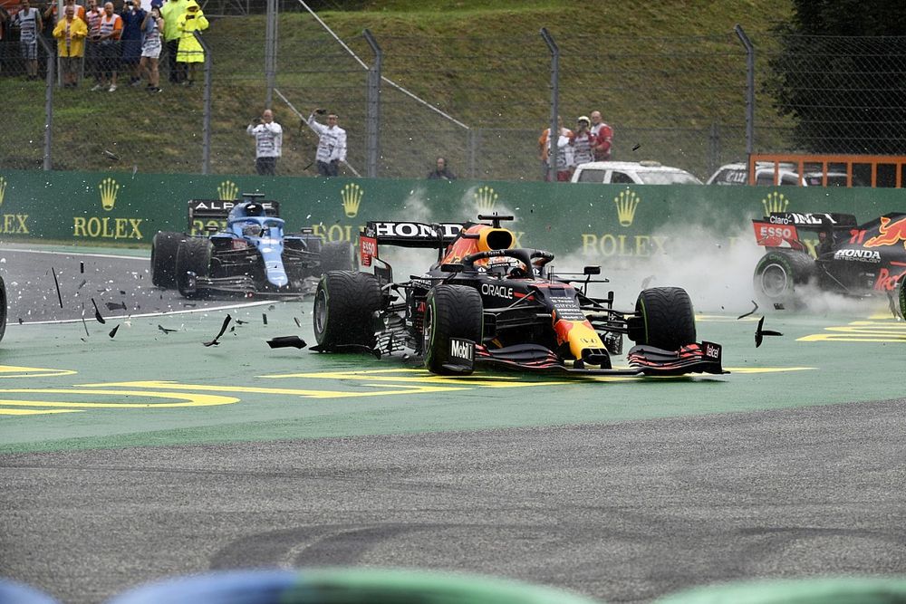 Lando Norris, McLaren MCL35M, Max Verstappen, Red Bull Racing RB16B, and Valtteri Bottas, Mercedes W12, collide at the start