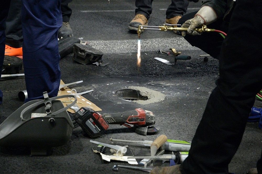 Work and discussion is undertaken to fix the loose manhole covers on track