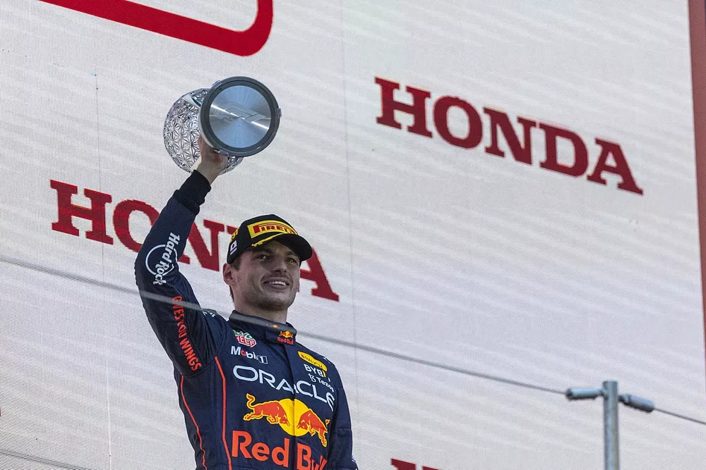 Max Verstappen, Red Bull Racing, 1st position, lifts the winners trophy on the podium