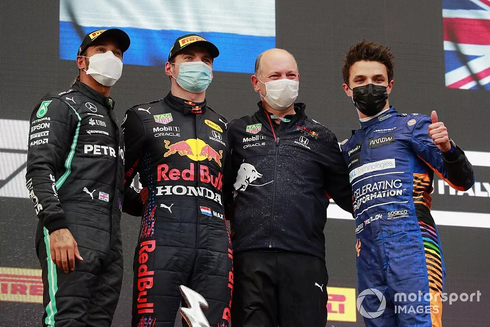 Lewis Hamilton, Mercedes, 2nd position, Max Verstappen, Red Bull Racing, 1st position, the Red Bull trophy delegate and Lando Norris, McLaren, 3rd position, on the podium