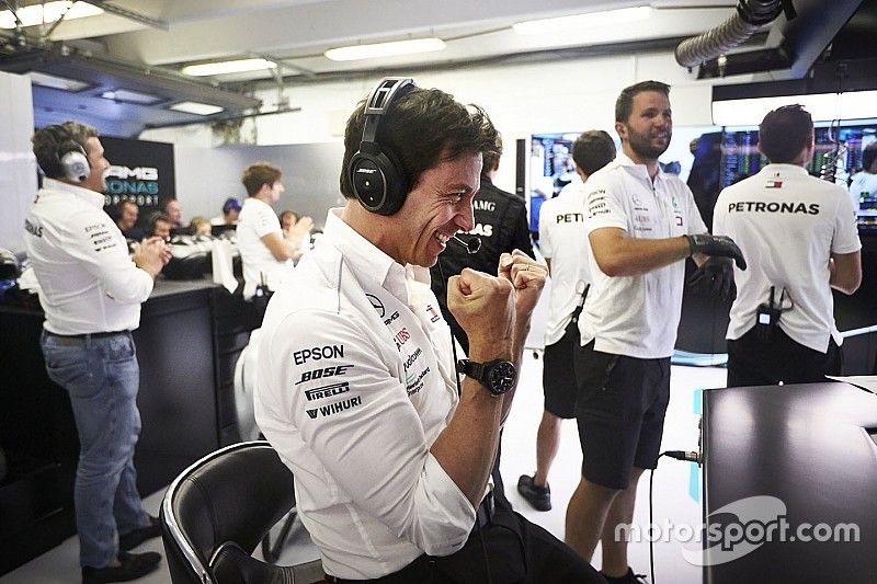 Toto Wolff, Executive Director, Mercedes AMG, celebrates as his drivers take the front row