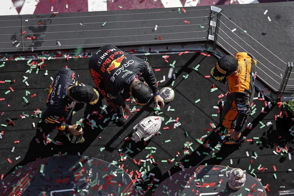 Sergio Perez, Red Bull Racing, 3rd position, Max Verstappen, Red Bull Racing, 1st position, Lando Norris, McLaren, 2nd position, on the podium