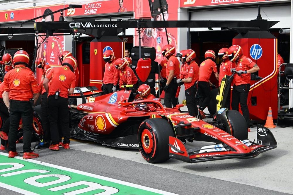 The Scuderia Ferrari pit crew do a pit stop on the car of Carlos Sainz, Ferrari SF-24 