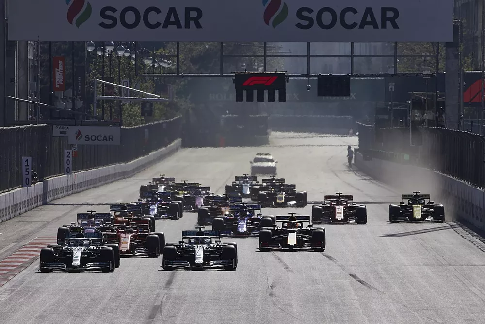 Valtteri Bottas, Mercedes AMG W10, leads Lewis Hamilton, Mercedes AMG F1 W10, Sebastian Vettel, Ferrari SF90, Sergio Perez, Racing Point RP19, Max Verstappen, Red Bull Racing RB15, and the rest of the field at the start