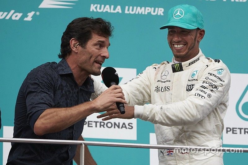 Mark Webber, TV Pundit, Channel 4 F1, interviews second place Lewis Hamilton, Mercedes AMG F1, on th