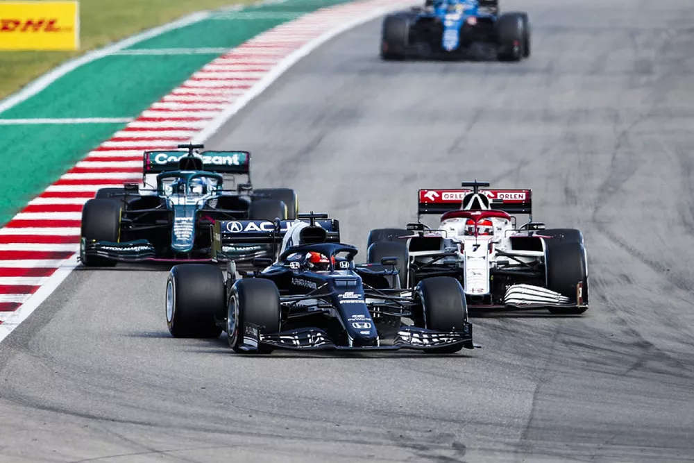 Yuki Tsunoda, AlphaTauri AT02, Kimi Raikkonen, Alfa Romeo Racing C41, and Lance Stroll, Aston Martin AMR21