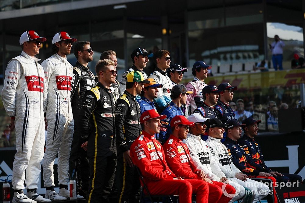 The class of 2019 pose for a final group photo. Back row L-R: Kimi Raikkonen, Alfa Romeo Racing, Antonio Giovinazzi, Alfa Romeo Racing, Romain Grosjean, Haas F1, Kevin Magnussen, Haas F1, Robert Kubica, Williams Racing, George Russell, Williams Racing, Sergio Perez, Racing Point, Lance Stroll, Racing Point. Middle row, L-R: Nico Hulkenberg, Renault F1 Team, Daniel Ricciardo, Renault F1 Team, Carlos Sainz Jr., McLaren MCL34, Lando Norris, McLaren, Pierre Gasly, Toro Rosso, and Daniil Kvyat, Toro Rosso. Middle row, L-R: Charles Leclerc, Ferrari, Sebastian Vettel, Ferrari, Lewis Hamilton, Mercedes AMG F1, Valtteri Bottas, Mercedes AMG F1, Max Verstappen, Red Bull Racing and Alexander Albon, Red Bull Racing 