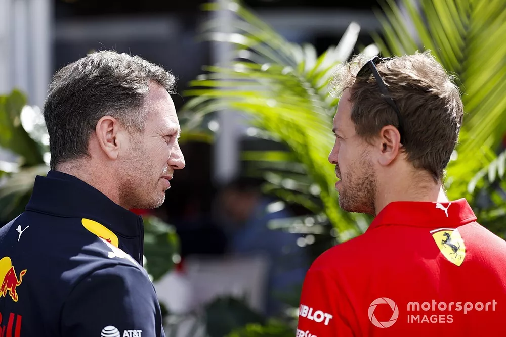 Christian Horner, director del equipo, Red Bull Racing y Sebastian Vettel, Ferrari