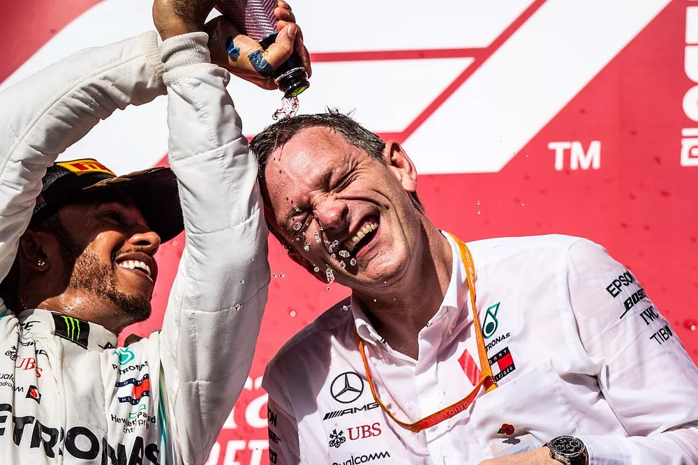 Lewis Hamilton, Mercedes AMG F1, 2nd position, pours Champagne over James Allison, Technical Director, Mercedes AMG, on the podium