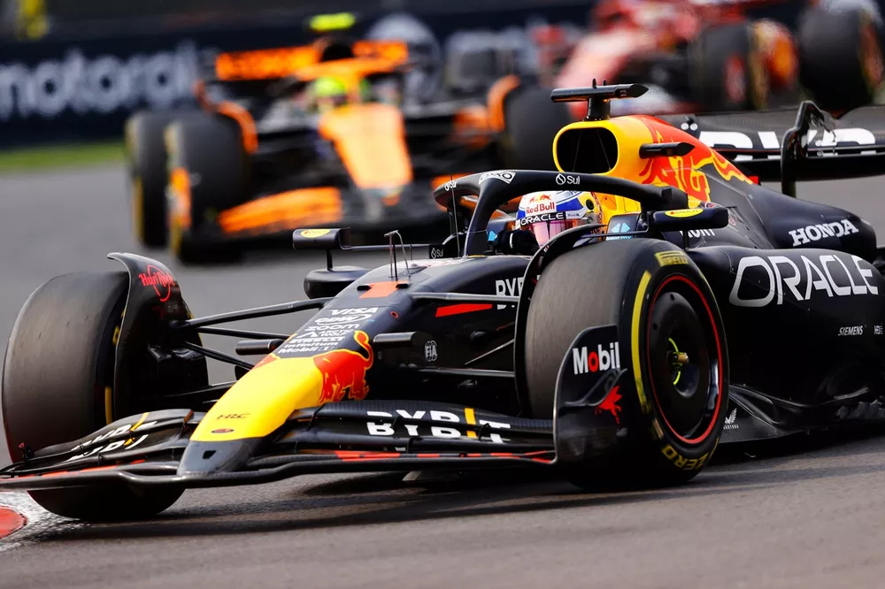 Max Verstappen, Red Bull Racing RB20, leads Lando Norris, McLaren MCL38