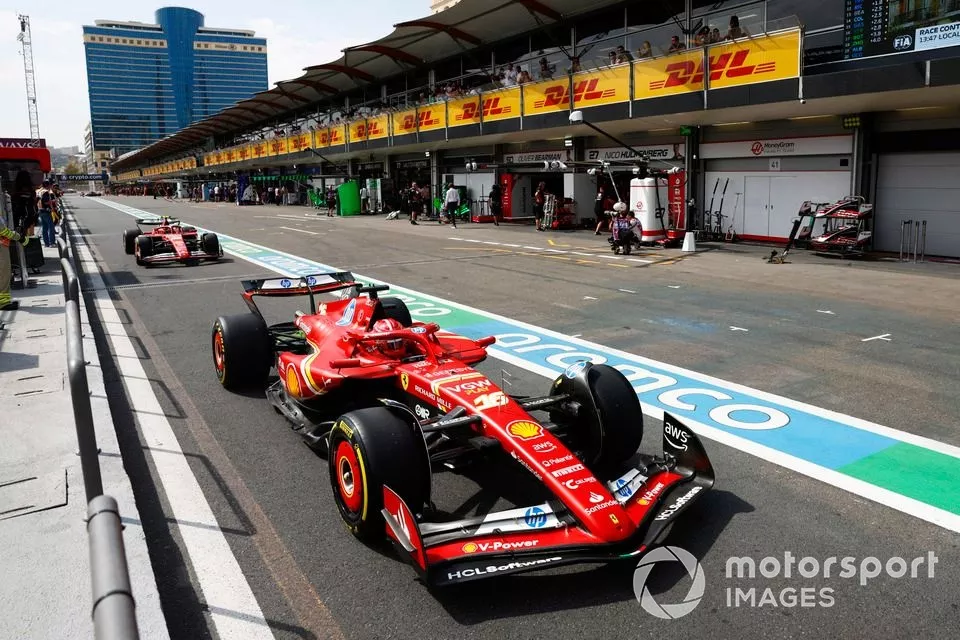 Charles Leclerc, Ferrari SF-24, Carlos Sainz, Ferrari SF-24, in the pit lane
