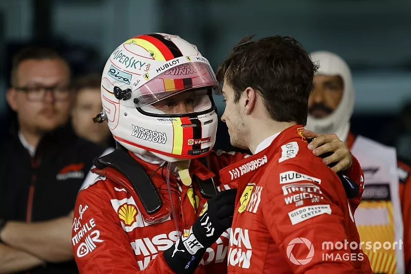 Sebastian Vettel, Ferrari, talks to his team mate Charles Leclerc, Ferrari, 3rd position, after the race