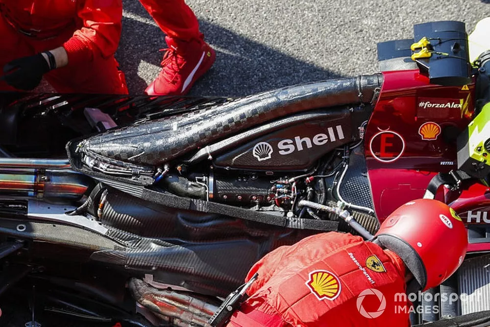 Ferrari mechanics at work on the grid