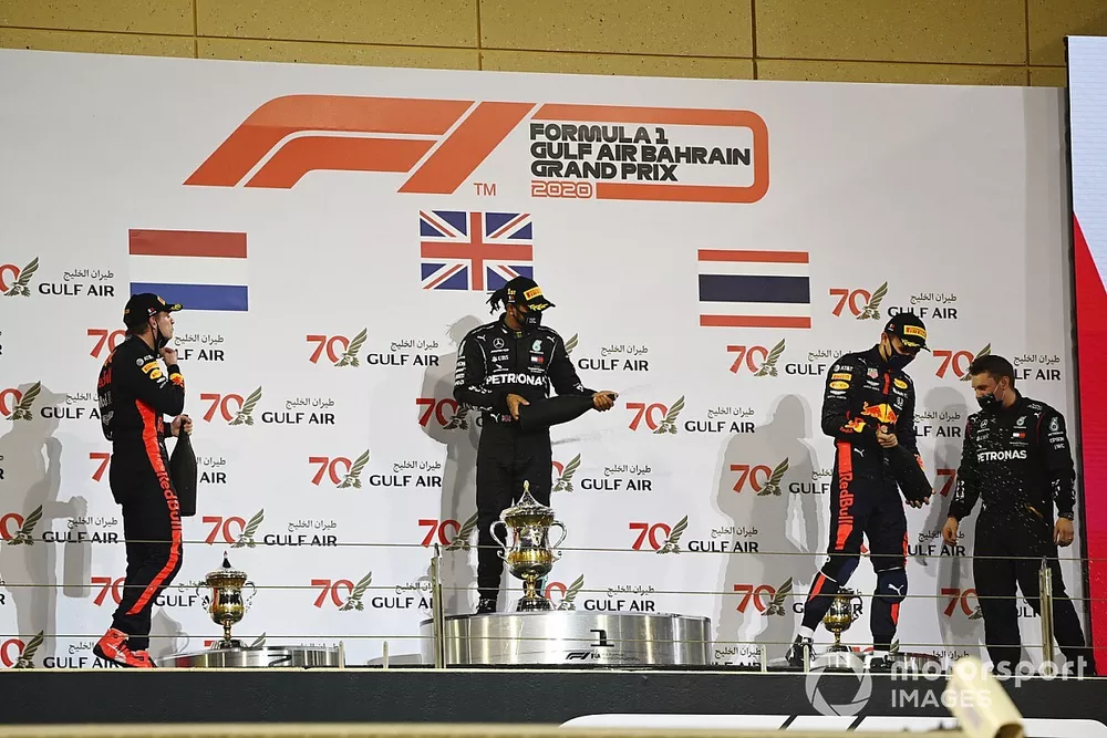 Max Verstappen, Red Bull Racing, 2nd position, Lewis Hamilton, Mercedes-AMG F1, 1st position, and Alex Albon, Red Bull Racing, 3rd position, celebrate on the podium