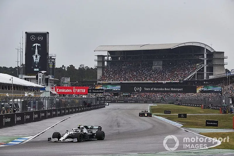 Valtteri Bottas, Mercedes AMG W10, leads Max Verstappen, Red Bull Racing RB15