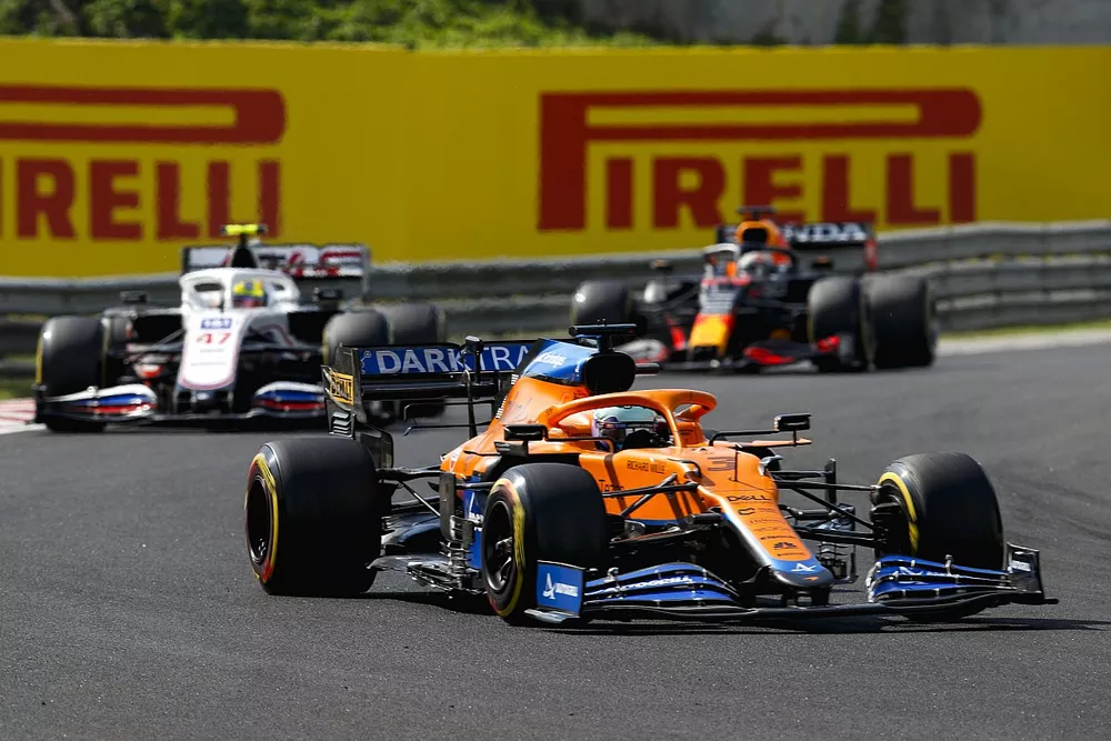 Daniel Ricciardo, McLaren MCL35M, Mick Schumacher, Haas VF-21, and Max Verstappen, Red Bull Racing RB16B