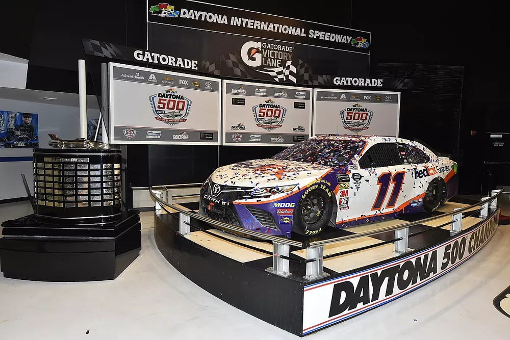 Denny Hamlin, Joe Gibbs Racing, Toyota Camry FedEx Express, Christopher Gabehart and Coach Joe Gibbs at the Daytona 500 Champions breakfast and car induction