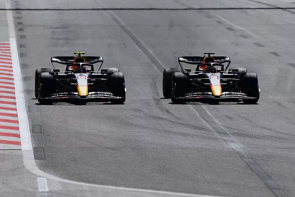 Max Verstappen, Red Bull Racing RB18, passes Sergio Perez, Red Bull Racing RB18