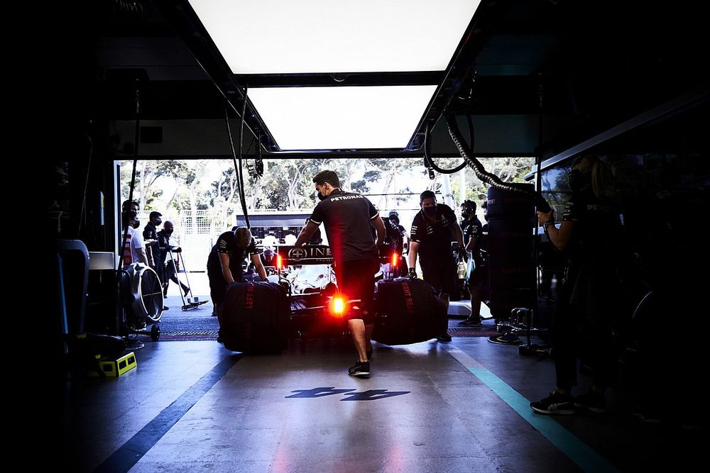 Lewis Hamilton, Mercedes W12, is returned to the garage