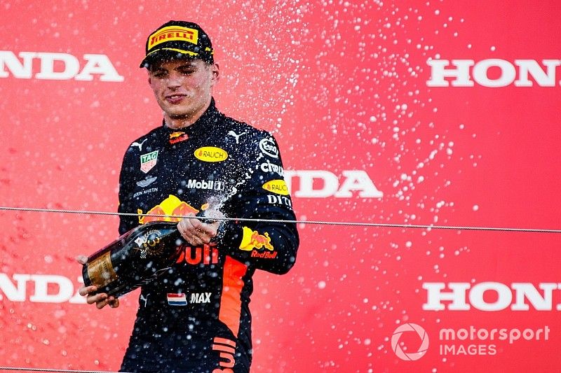 Third place Max Verstappen, Red Bull Racing, sprays Champagne on the podium 